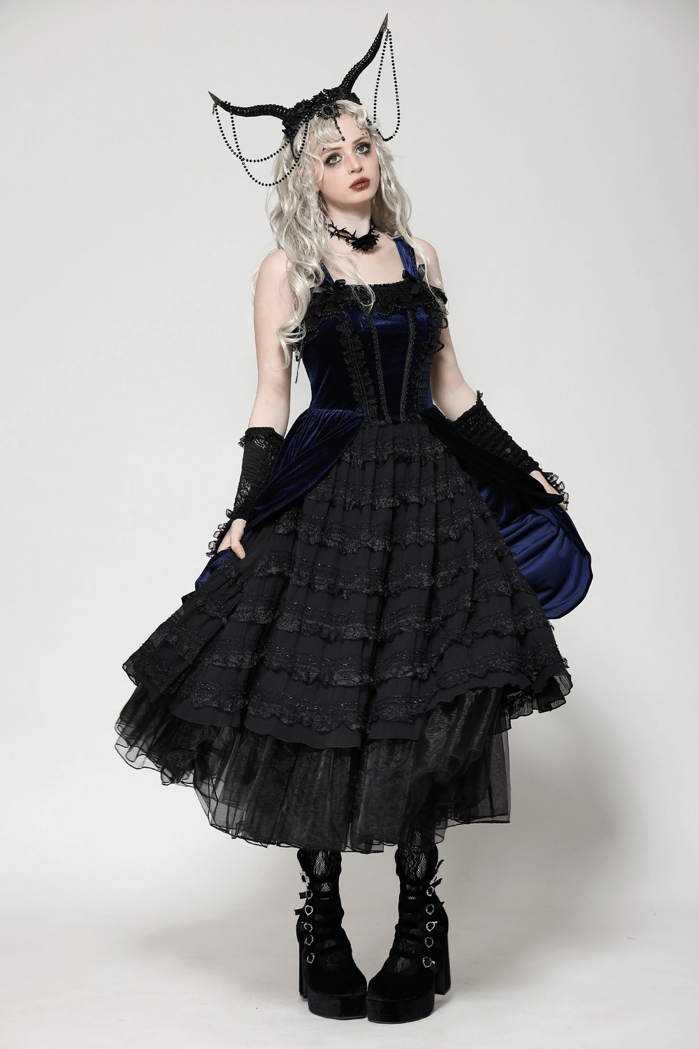 Gothic Lolita dress in black and navy with ruffled lace, adjustable straps, and dramatic accessories. Perfect for vintage elegance!