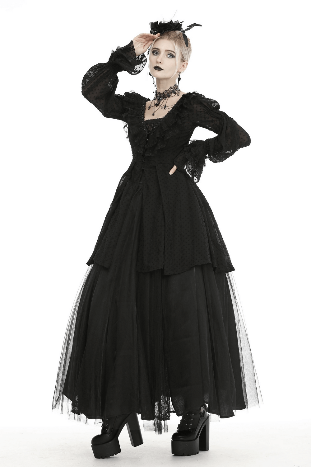 Gothic Lolita long black dress with ruffles, lace detailing, and platform shoes for a dramatic look.