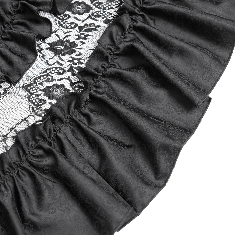 Close-up of luxurious black lace with ruffled satin edges, showcasing stylish gothic design details.
