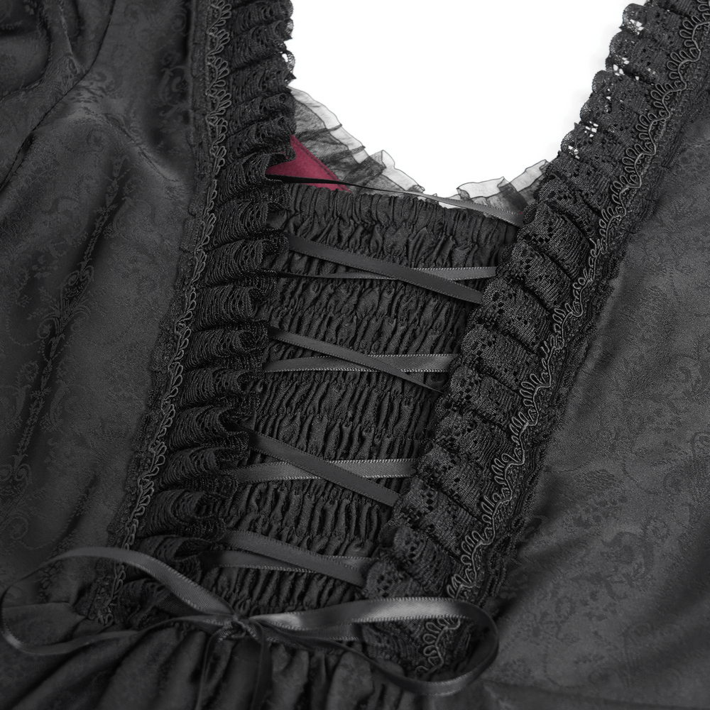 Close-up of black lace and ribbon detail on a Gothic medieval-style dress, showcasing intricate craftsmanship.