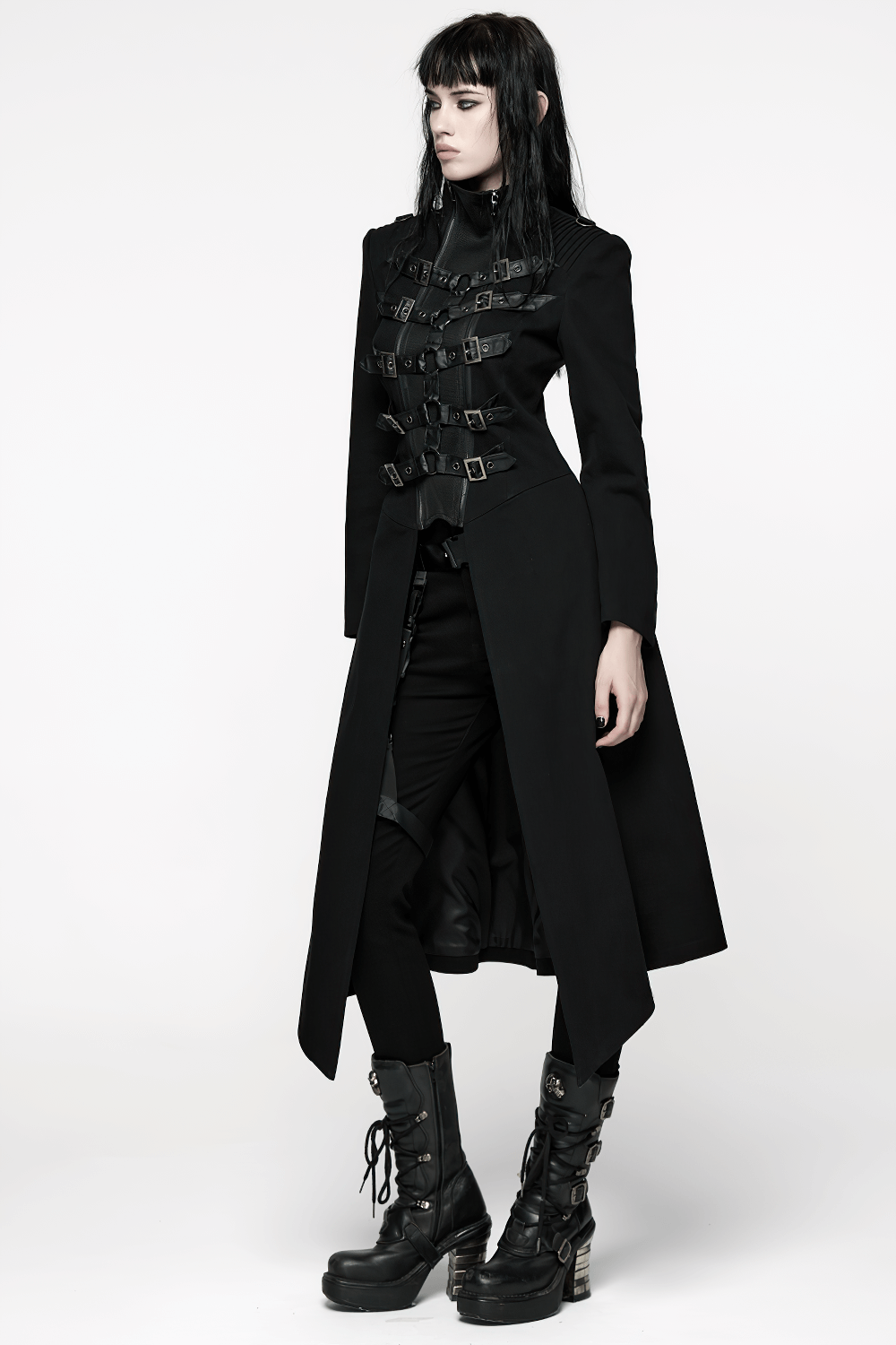 Gothic Long Black Coat with Straps and Buckle Detail worn by model, showcasing punk style and bold accessories.