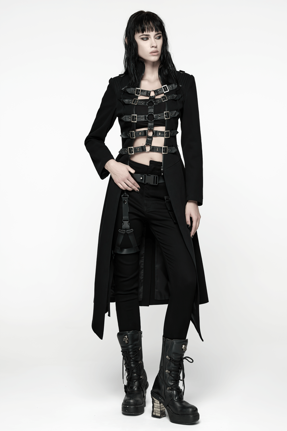 Gothic Long Black Coat with Straps and Buckle Detail worn by model, showcasing punk style and bold fashion.