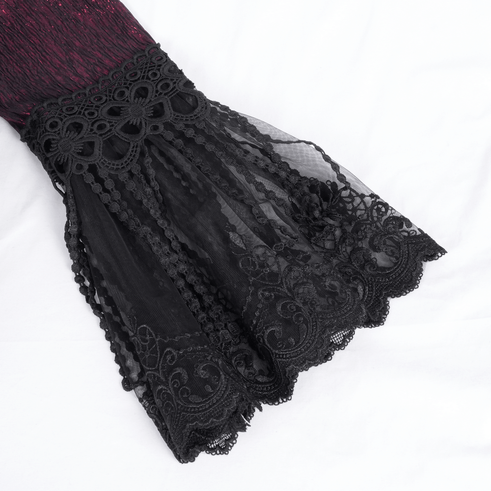 Close-up of intricate black lace detail on a Gothic long cape, showcasing elegant Victorian design elements.