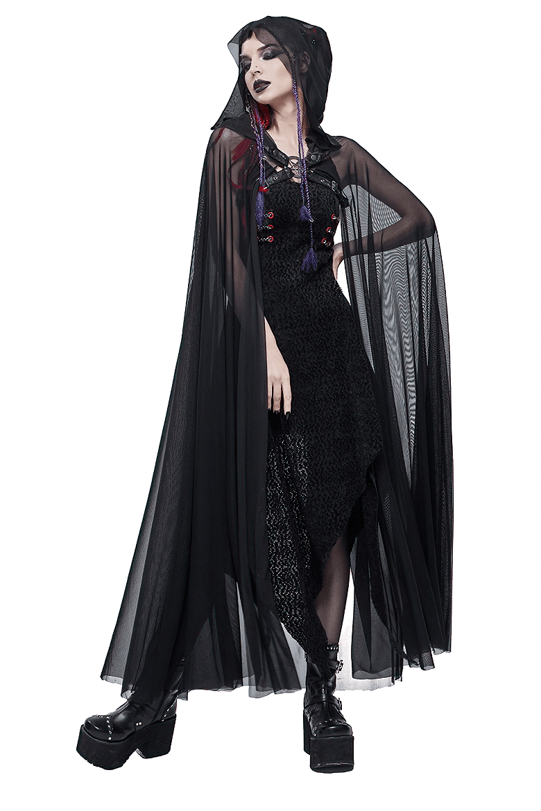 Elegant black gothic cloak with hood, sheer fabric, styled with a dark outfit and chunky shoes.