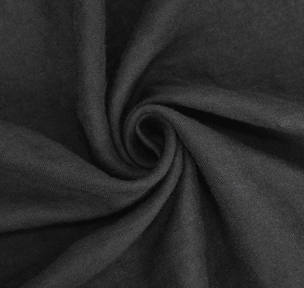 Close-up of soft, flowing black fabric ideal for gothic cloaks and stylish evening wear.