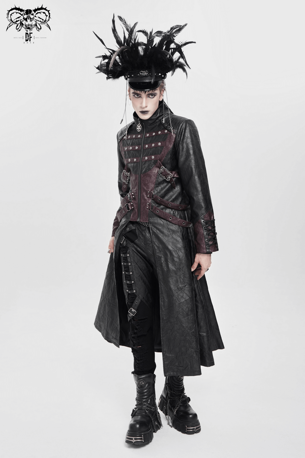 Model wearing a Gothic Long Coat with Buckled Panels and Metal Accents, showcasing a dramatic style with feathers.