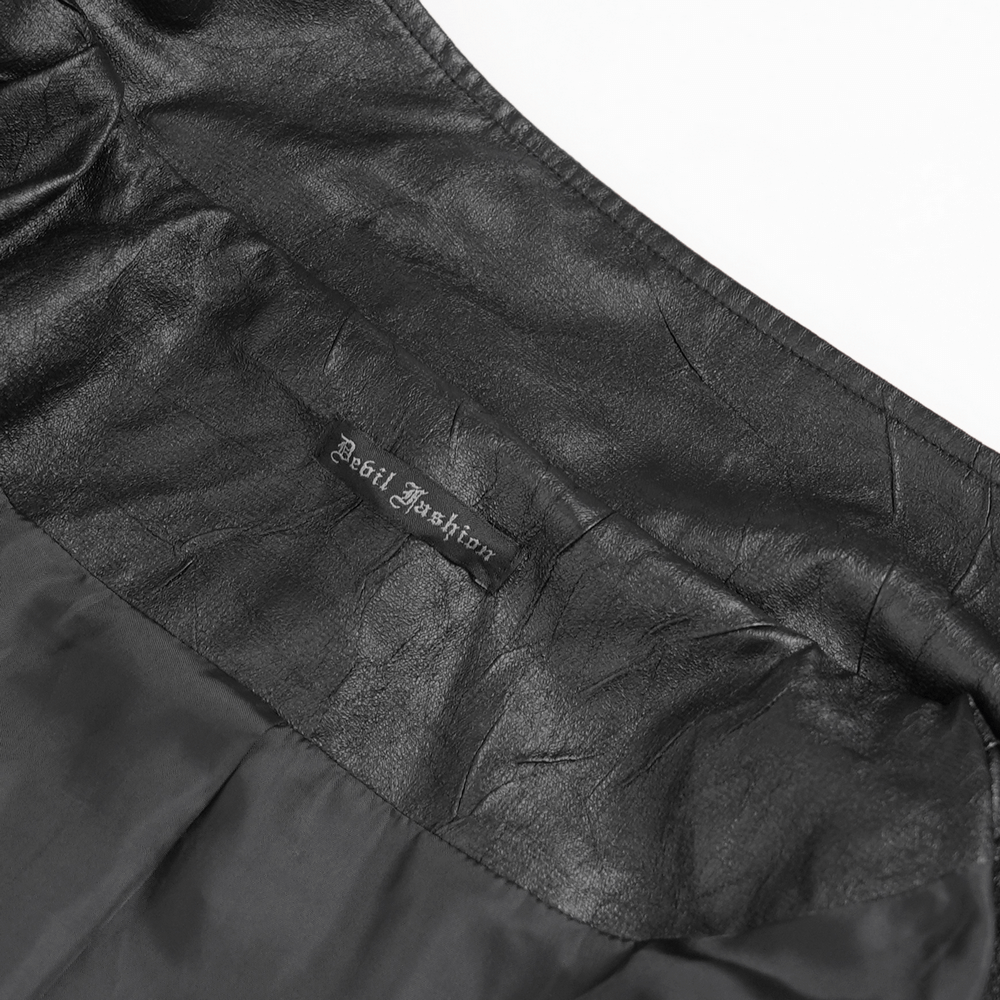 Gothic Long Coat with Buckled Panels and Metal Accents label detail showcasing dark fabric texture.