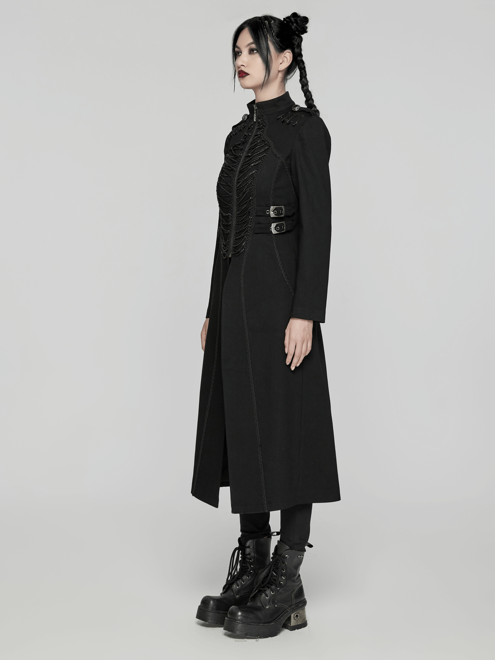 Black gothic long coat with chains and buckles, worn by a model, exuding punk elegance and style.