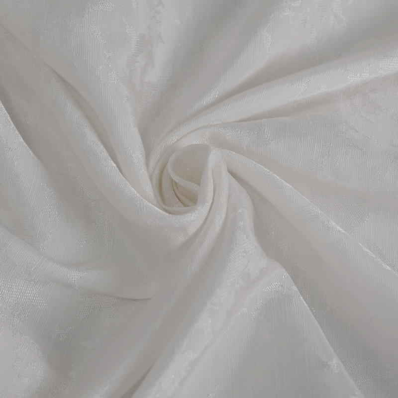 Close-up of luxurious white fabric featuring intricate jacquard patterns, perfect for gothic vintage shirts.