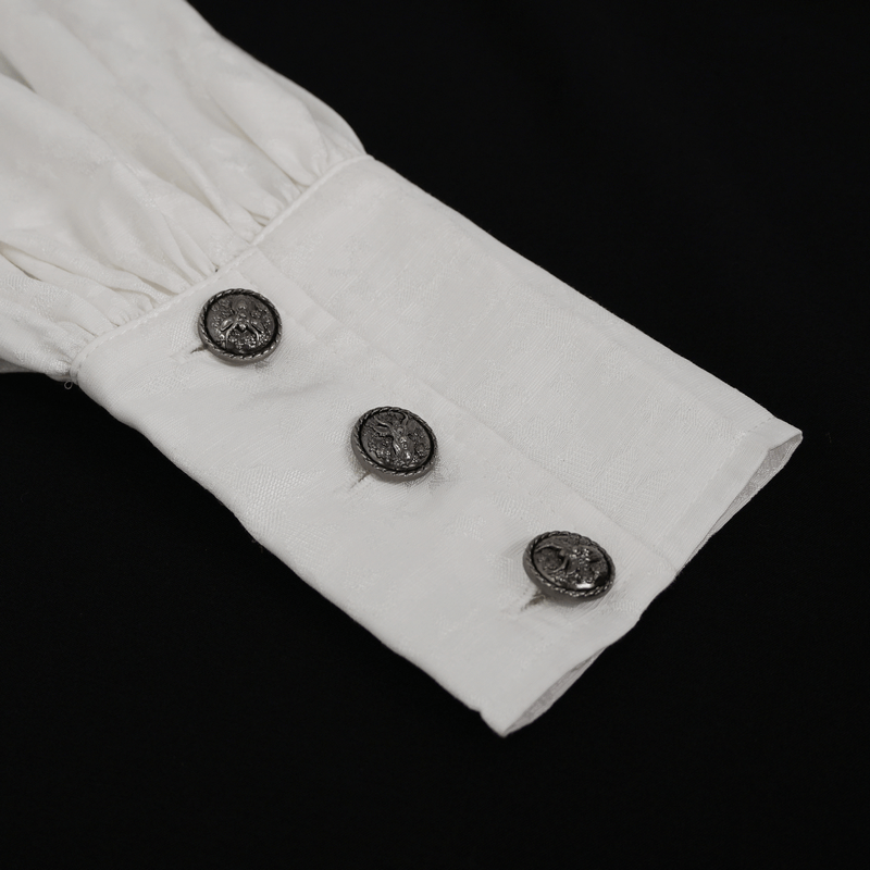 Close-up of gothic white shirt cuff with vintage buttons and elegant lantern sleeve detail.