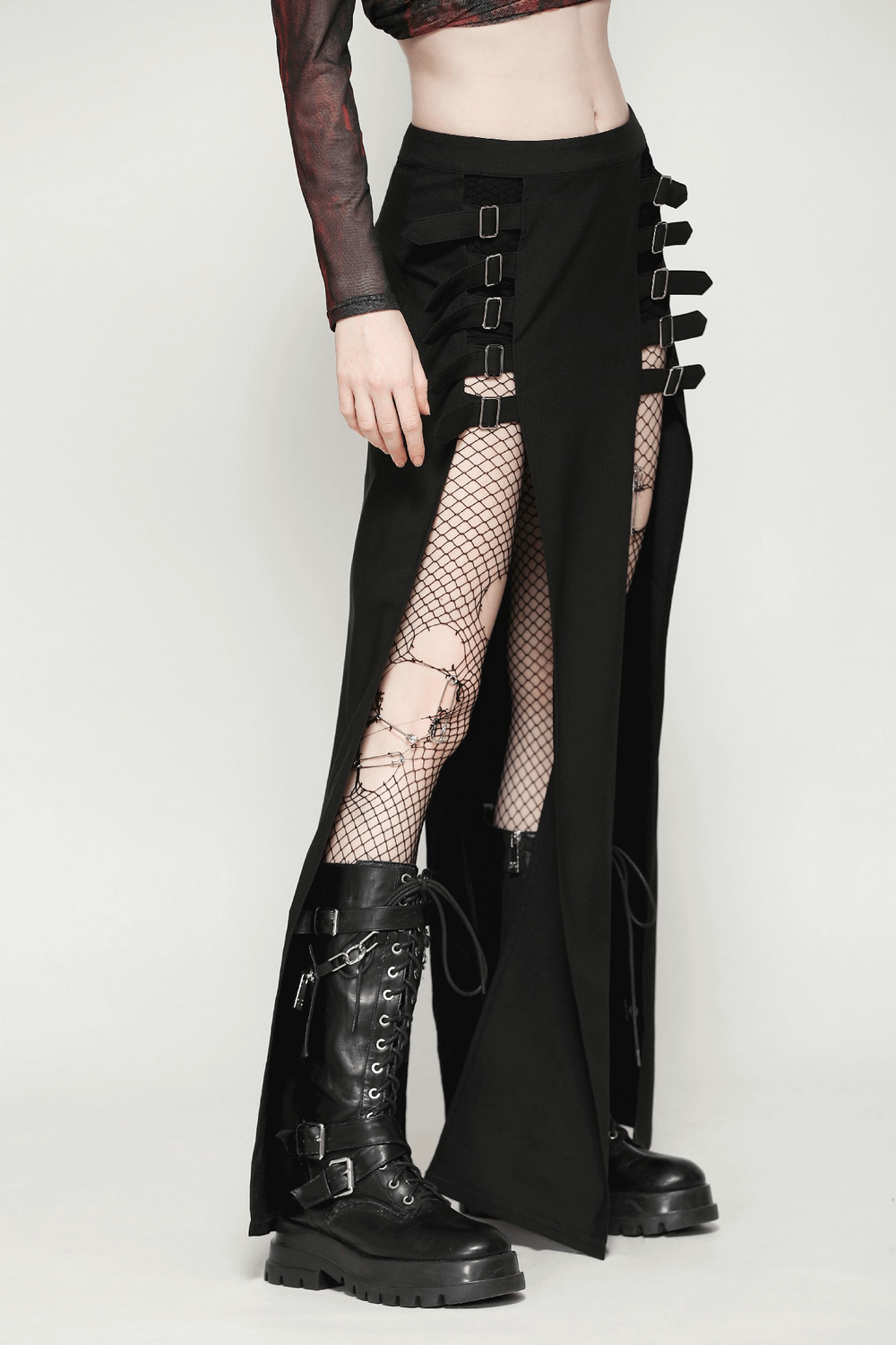 Gothic long skirt featuring stylish side cutouts and buckle straps, paired with edgy black combat boots.