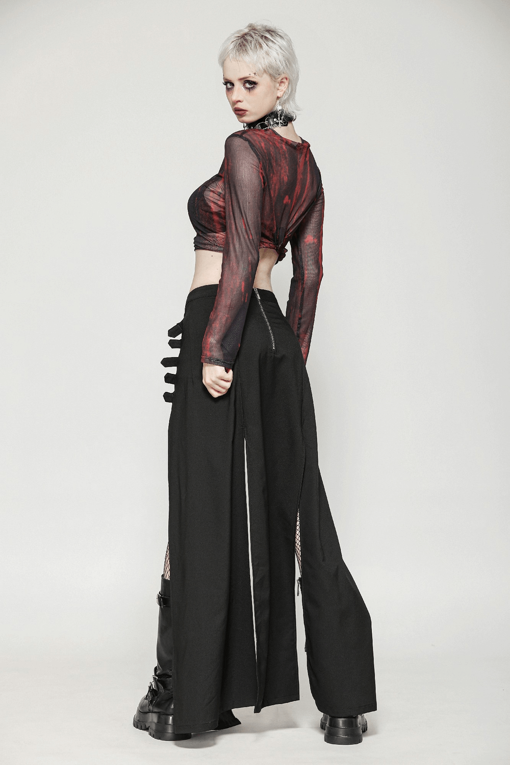 Gothic long skirt featuring side cutouts and stylish buckle straps, perfect for edgy fashion lovers.