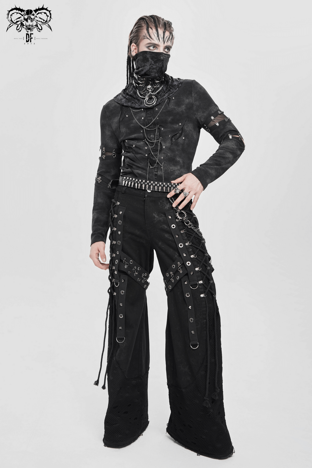 Gothic Long Sleeve Top with Chains and Cutout Design worn with edgy pants featuring studs and straps for a bold punk look.