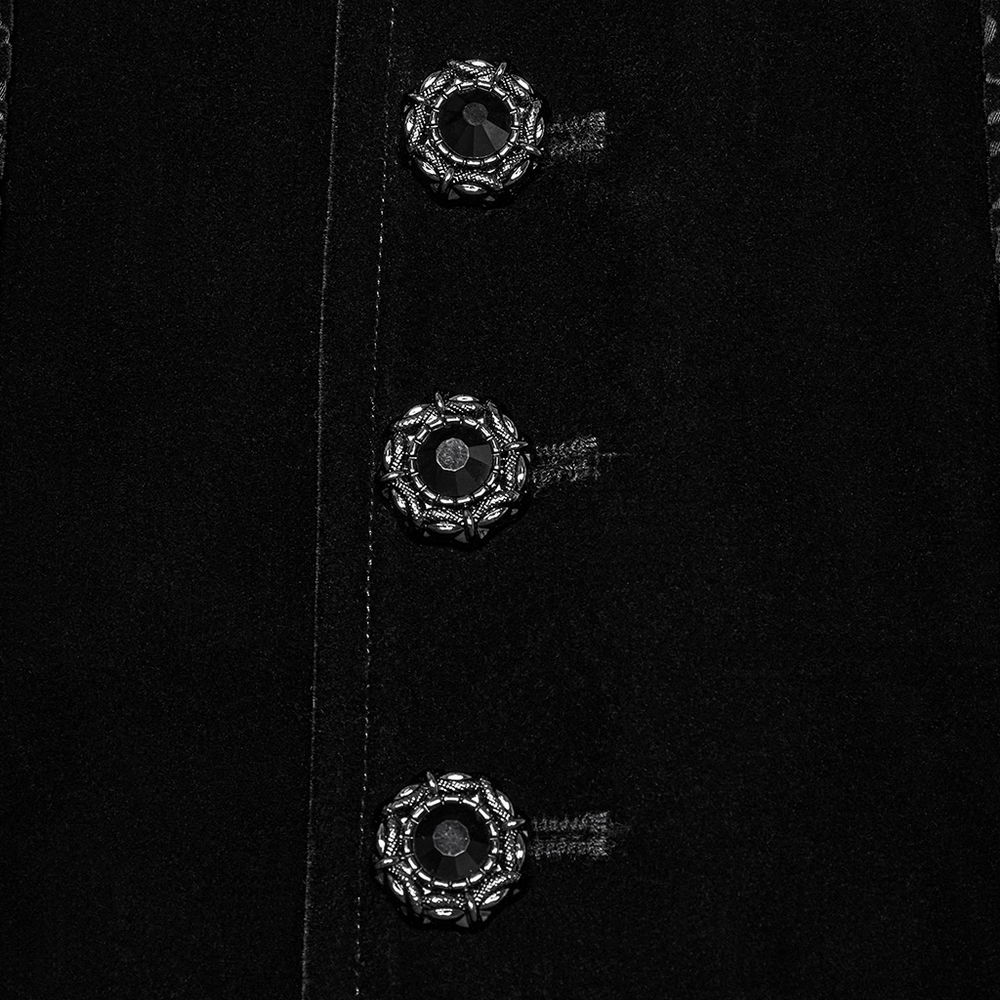 Close-up of ornate buttons on a gothic long waistcoat with a dramatic design and rich texture.