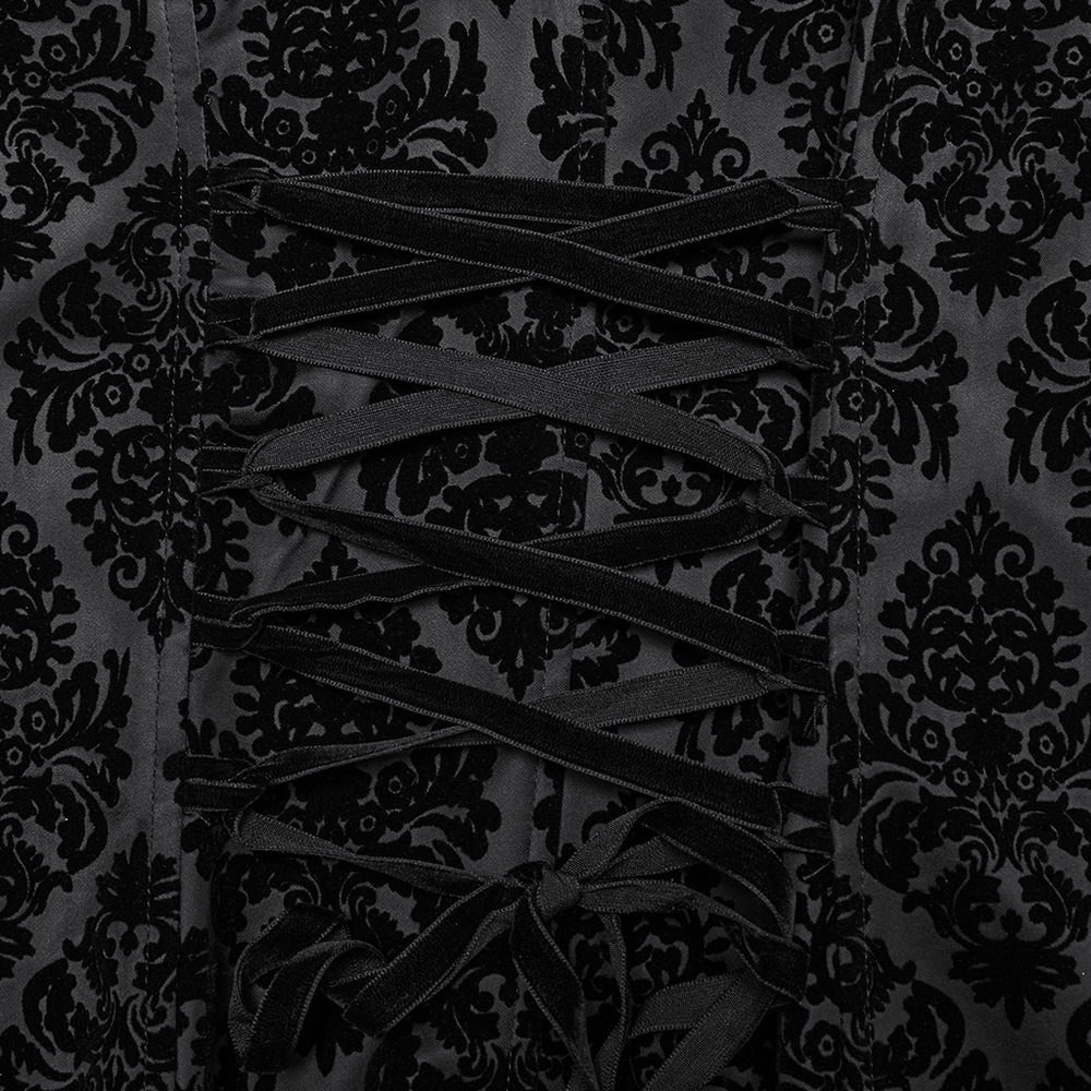 Close-up of gothic long waistcoat fabric with intricate flocking patterns and velvet lace detail.