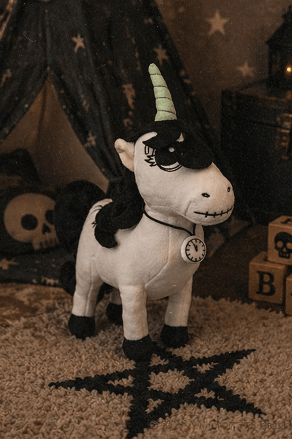Gothic Lunabones Unicorn Halloween Guardian Plush displayed in a mystical setting with starry backdrop.