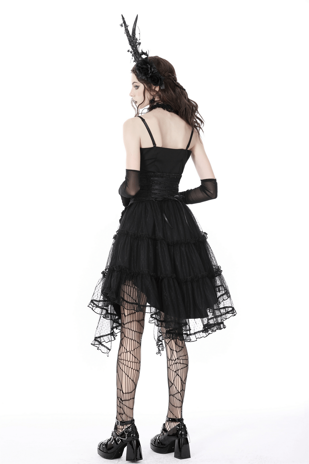 Back view of a model wearing a Gothic Luxe Mesh Skirt with Corset Belt, showcasing elegant layered tulle and lace details.