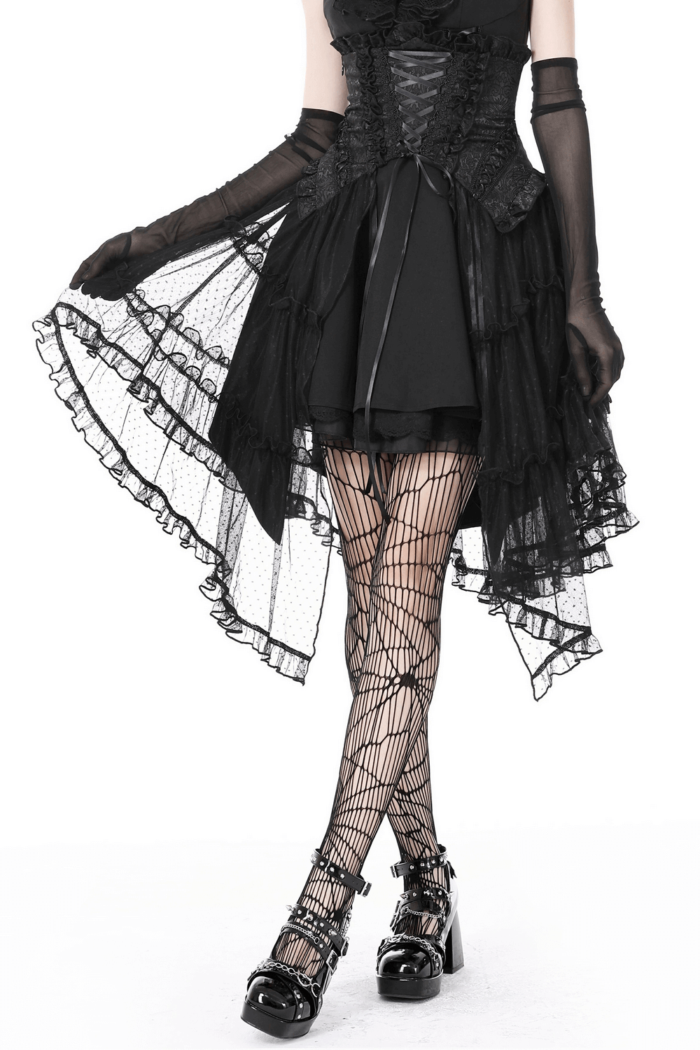 Elegant black gothic mesh skirt with corset belt, layered tulle, and stylish fishnet stockings for women.