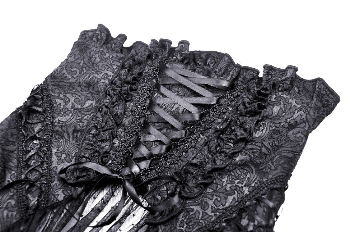 Close-up of the intricate lace detailing and corset design on a black gothic skirt, showcasing elegant gothic fashion.