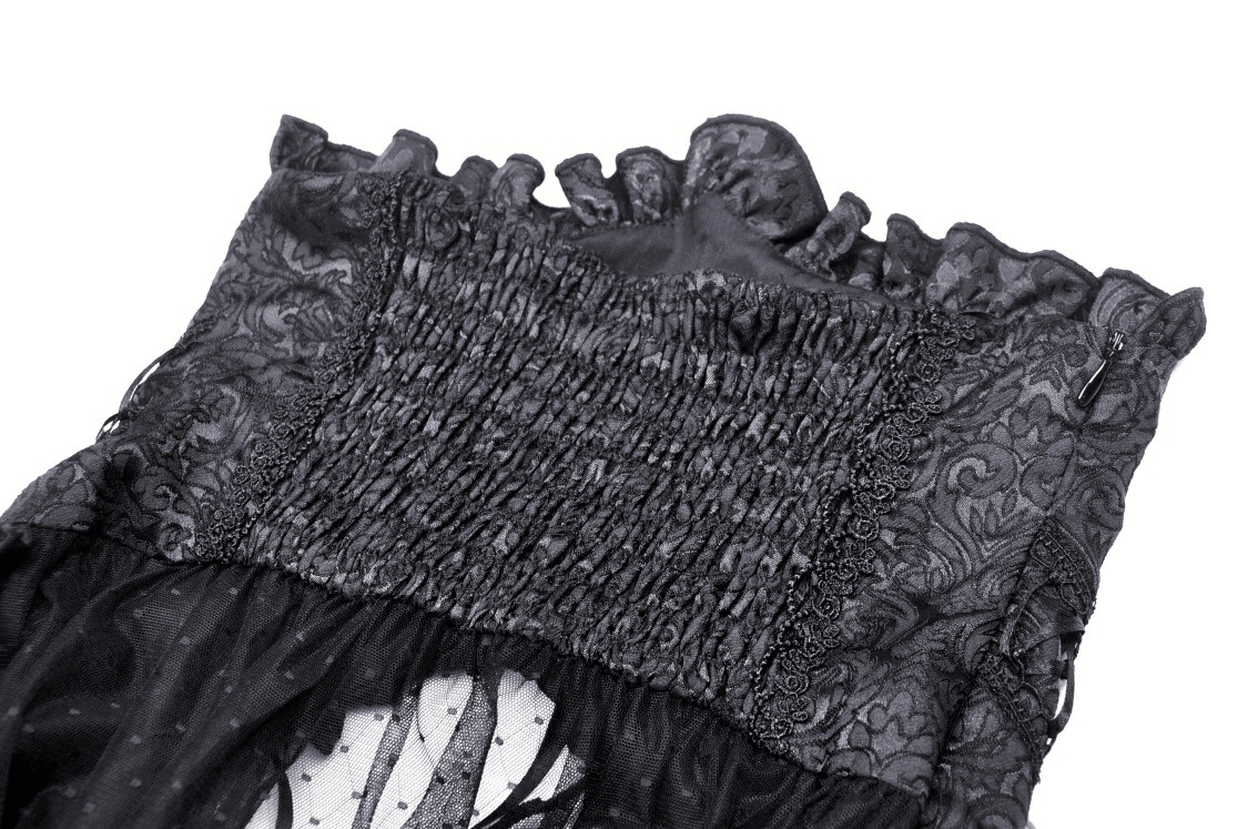 Close-up of a black gothic mesh skirt featuring intricate lace detailing and corset-style smocking.