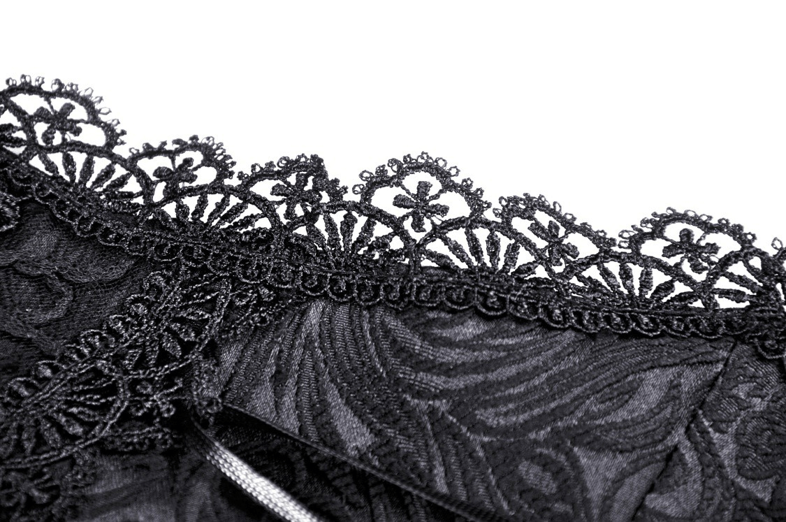 Close-up of intricate black lace trim on a Gothic corset, showcasing elegant patterns and delicate detailing.