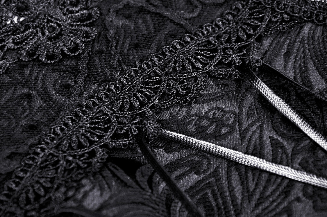 Close-up of black lace corset detailing with delicate lace overlay and garter straps for an alluring gothic look.