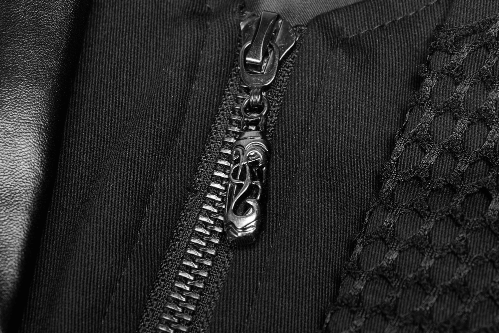 Close-up of a black zipper with intricate design on a Gothic leather coat.