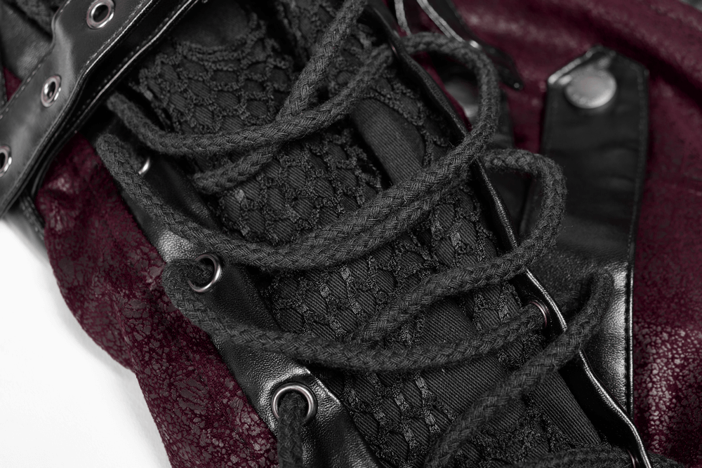 Close-up of intricately laced sleeves on a burgundy leather gothic trench coat showcasing elegant detail.