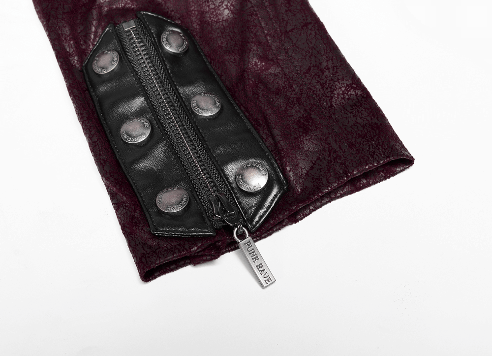 Close-up of the intricately laced sleeve of a burgundy leather gothic trench coat with silver buttons and zipper.