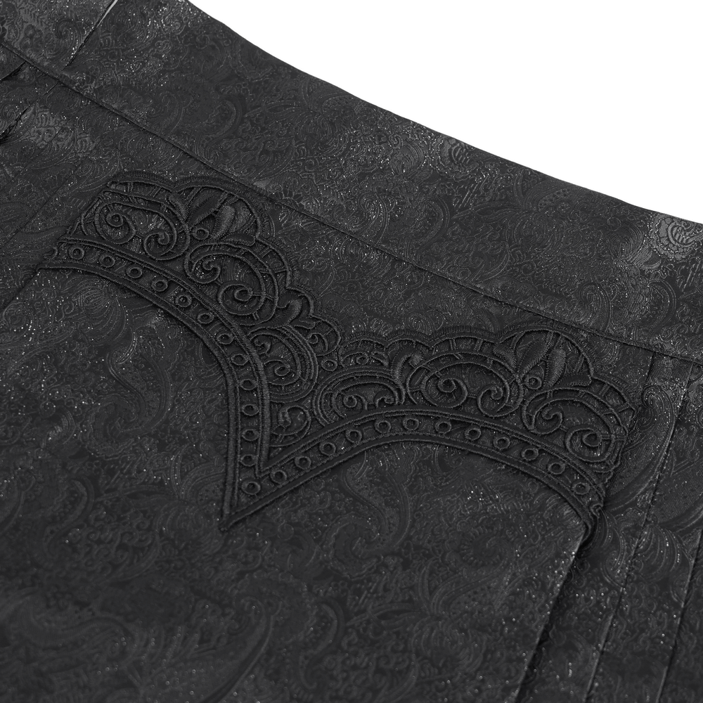 Close-up of gothic maxi skirt showing intricate jacquard pattern and ornate lace trim detail.