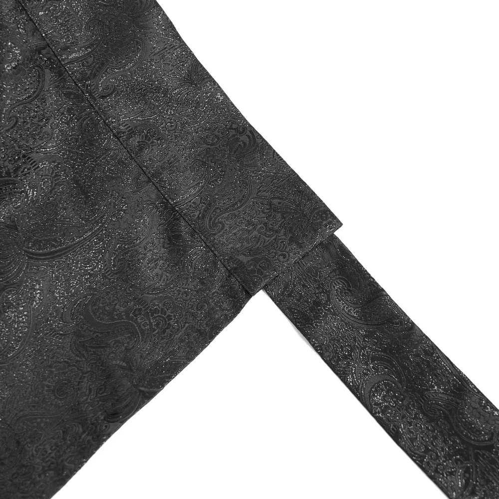 Close-up of textured black fabric with intricate jacquard pattern, ideal for a gothic maxi skirt design.