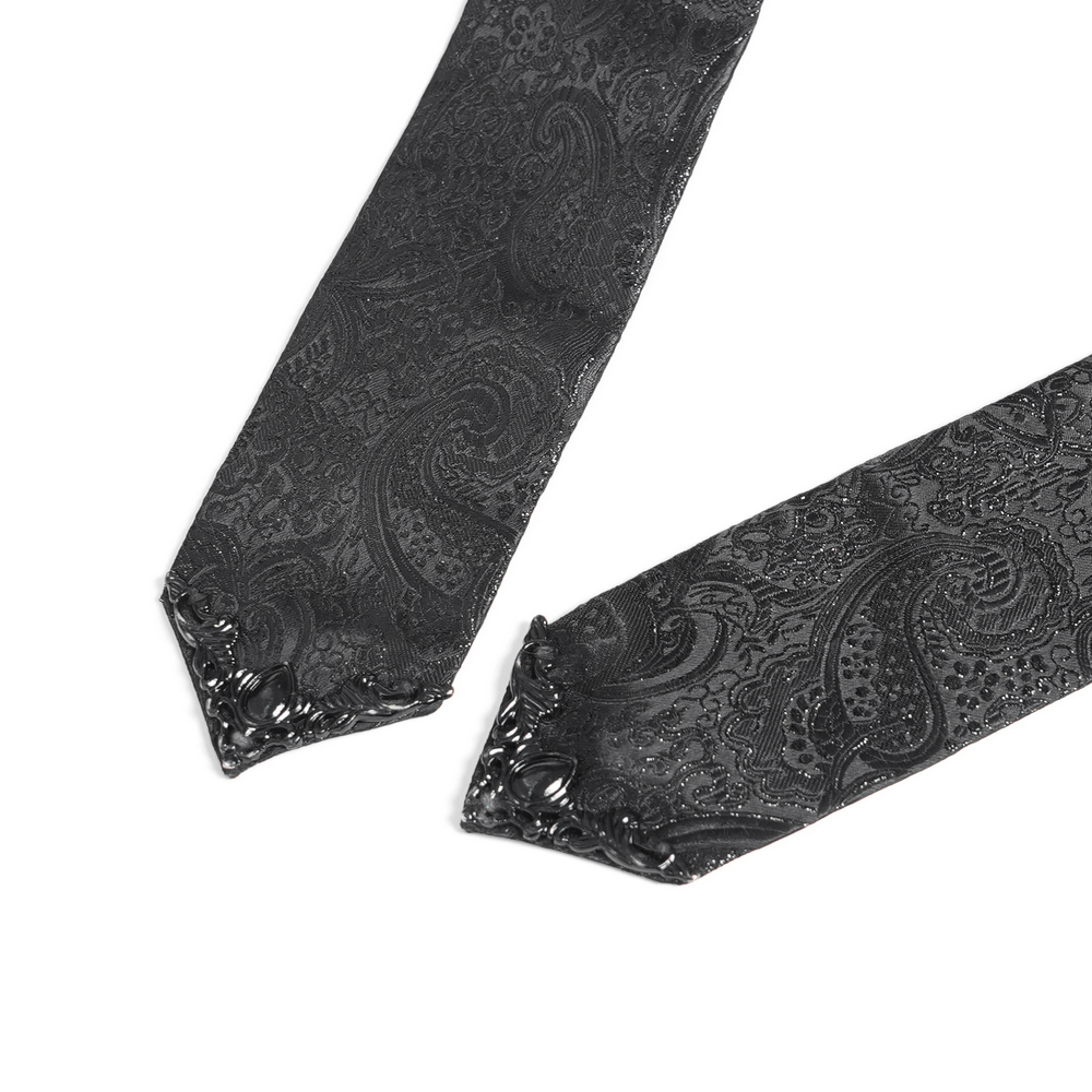 Elegant black paisley tie with intricate patterns and a stylish pointed end, perfect for formal wear.