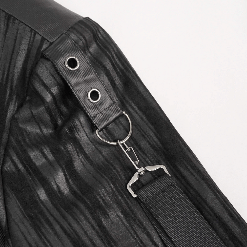 Close-up of gothic men's short jacket's metal eyelets and rings, showcasing stylish black striped design.