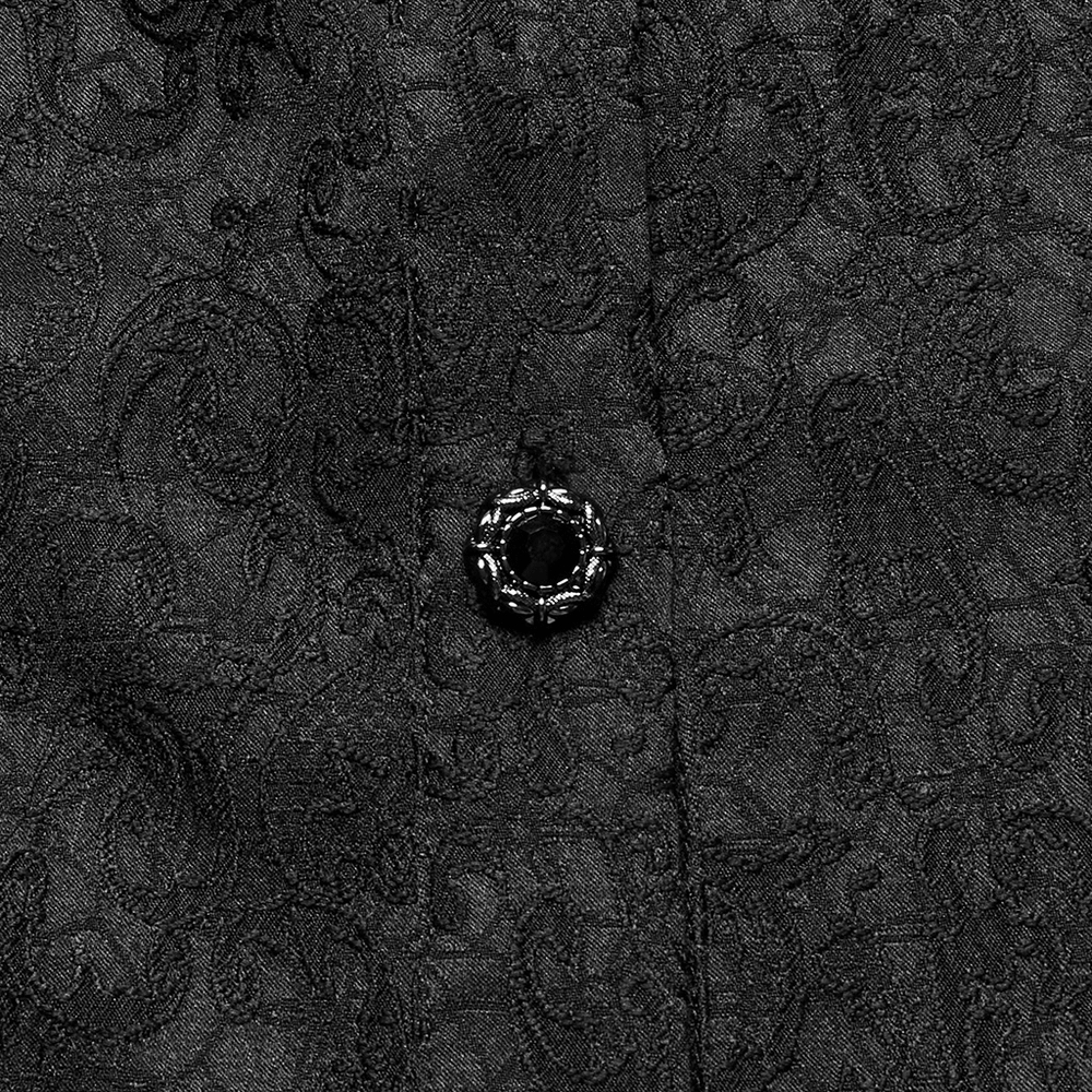 Close-up of a black gothic shirt's ornate fabric and decorative button, highlighting its elegant texture and design.