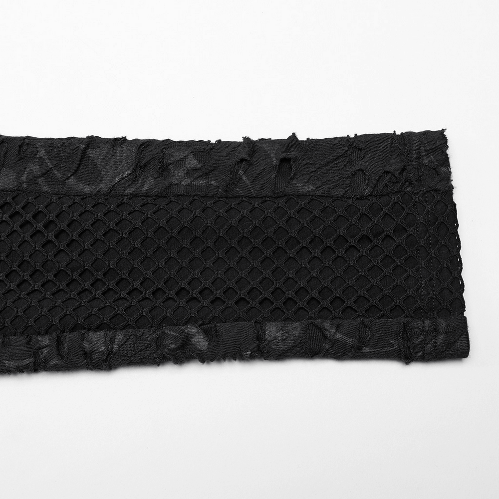 Close-up of black lace fabric with mesh detail, perfect for gothic fashion accents and clothing designs.