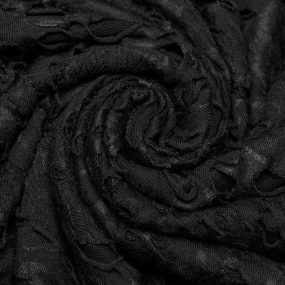Close-up of black textured fabric with a spiral pattern, ideal for gothic apparel and edgy fashion.