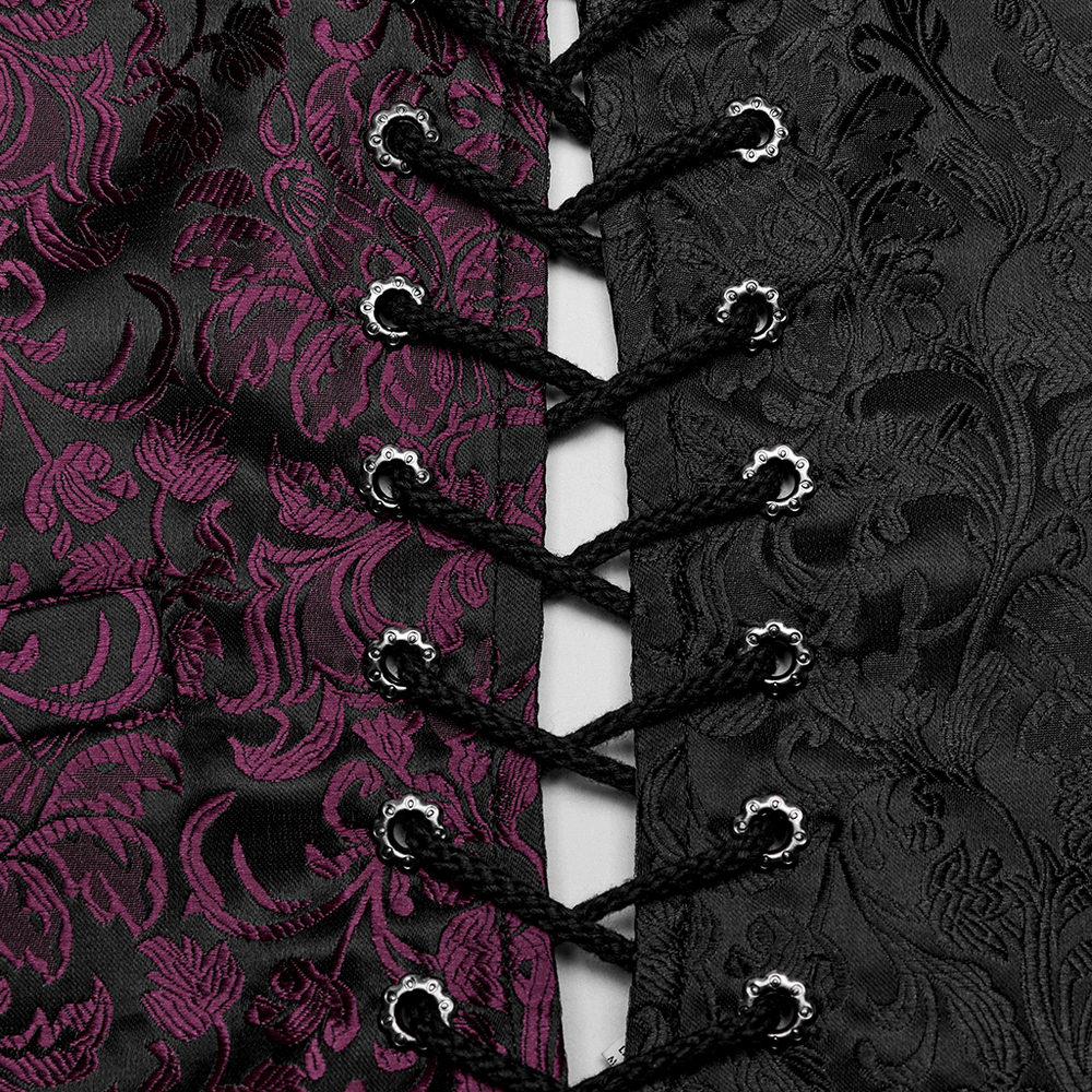 Close-up of gothic jacquard waistcoat with floral pattern and intricate eyelet drawstring design.