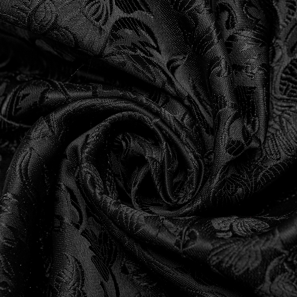 Close-up of intricate black jacquard fabric, showcasing elegant floral patterns perfect for a gothic waistcoat.