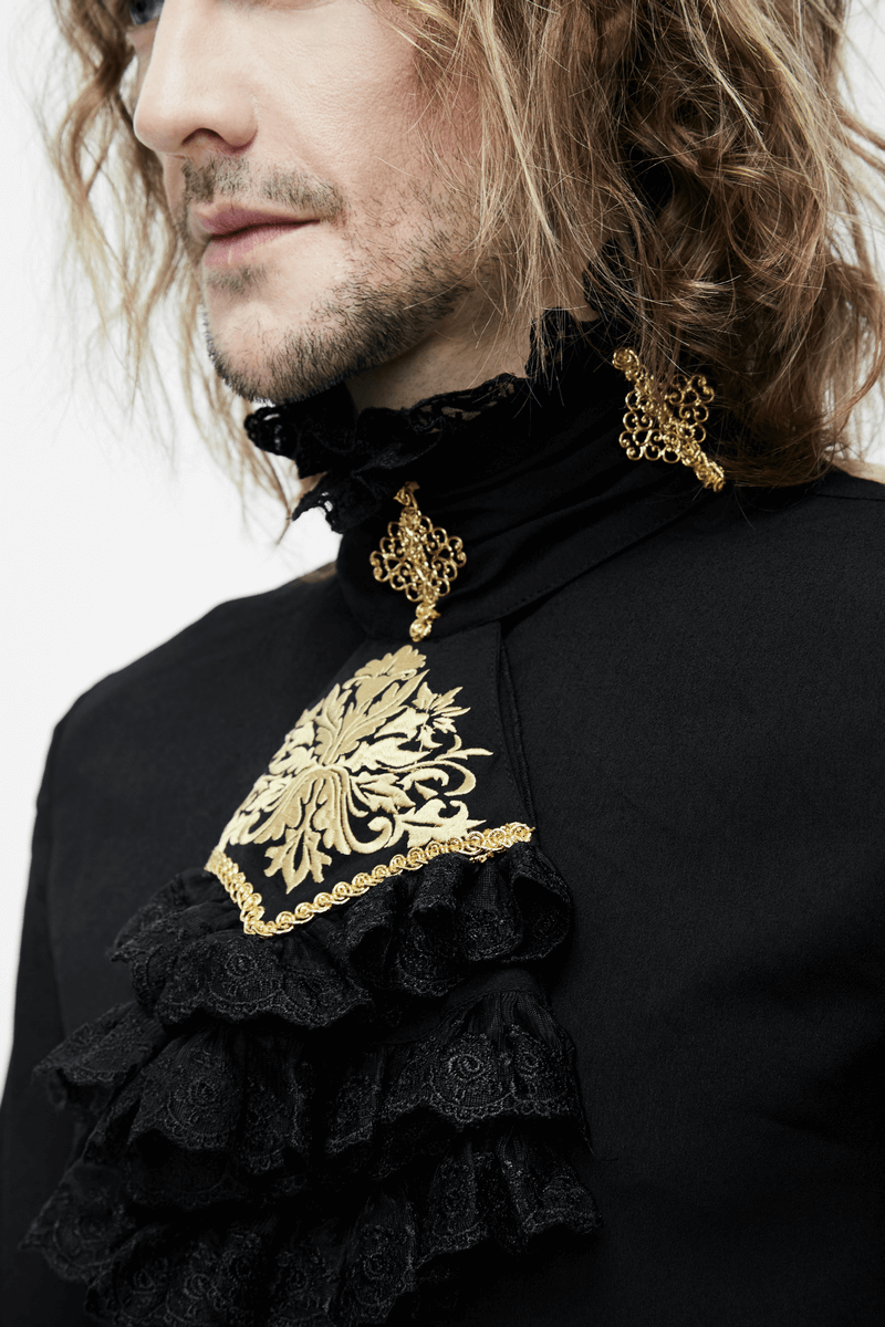 Close-up of a man's gothic black shirt featuring a ruffled neck, gold patterns, and intricate chiffon detailing.