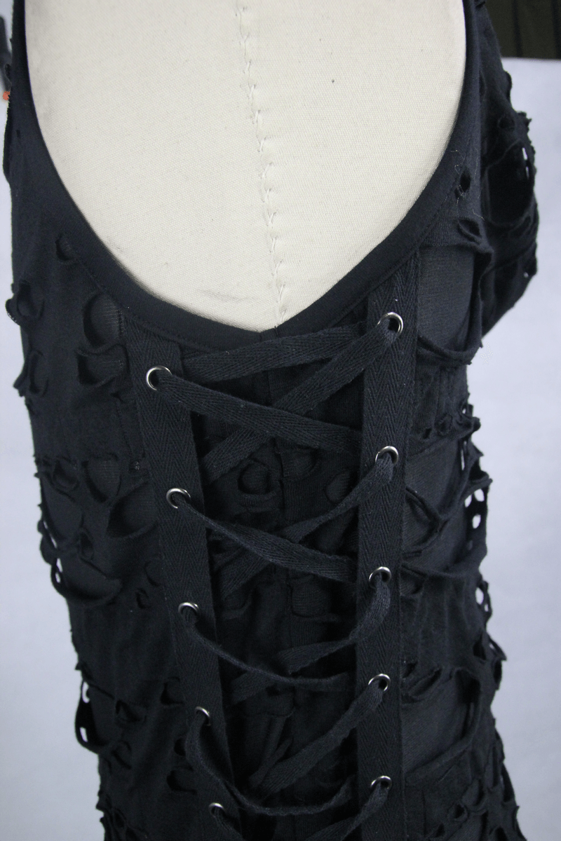 Close-up of a gothic men's black torn tank top with stylish lace-up back design and cut-out details.