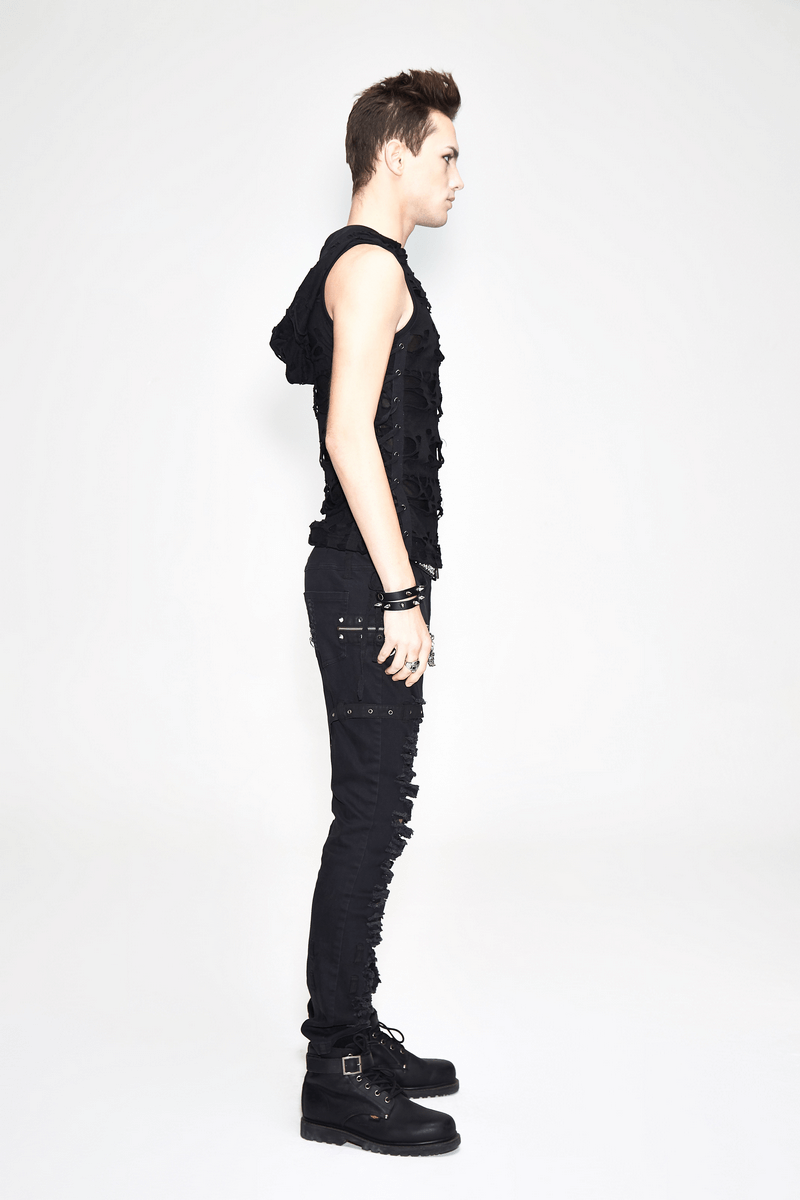 Profile view of a man in a black gothic torn tank top with hood, showcasing alternative style clothing.