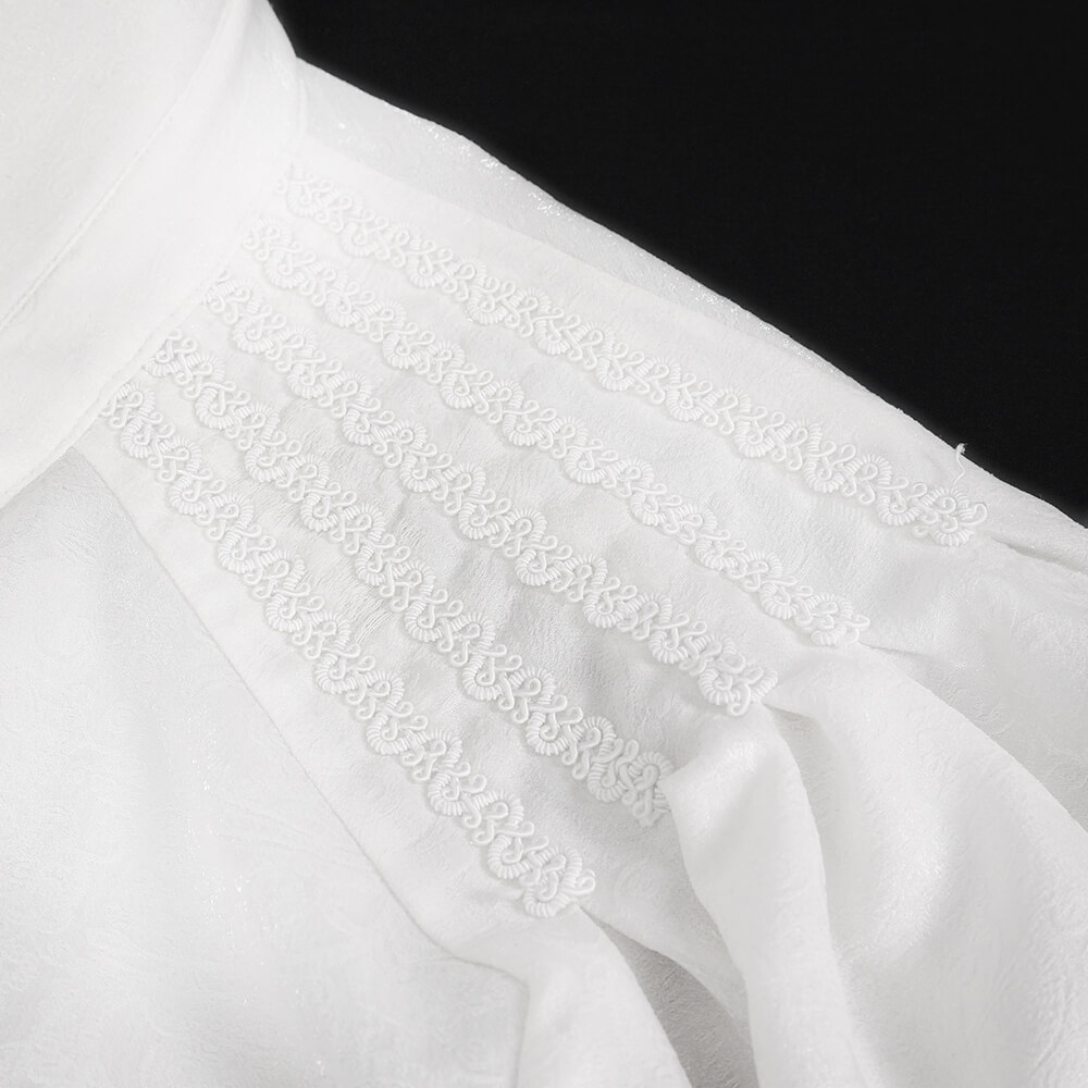 Close-up of a gothic shirt collar with intricate white floral embroidery and puff sleeve detailing.
