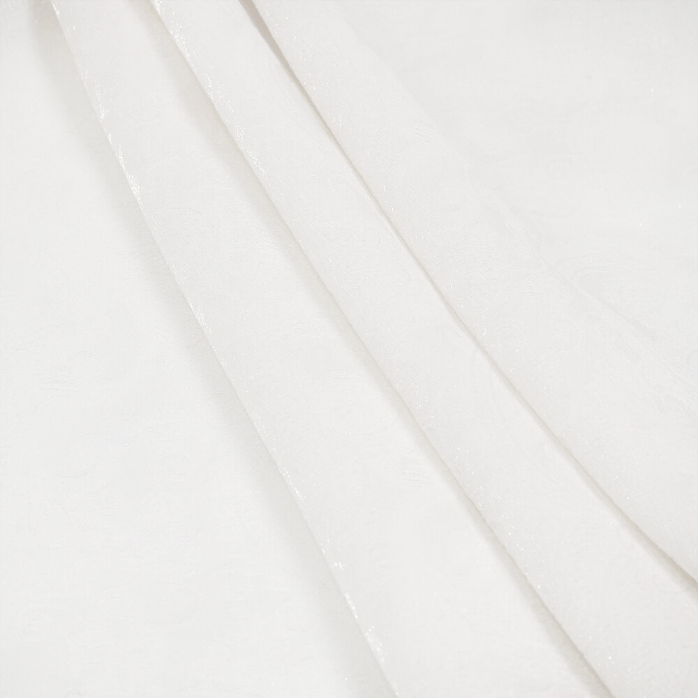 Elegant white fabric showcasing intricate floral embossing, perfect for gothic men's shirts.