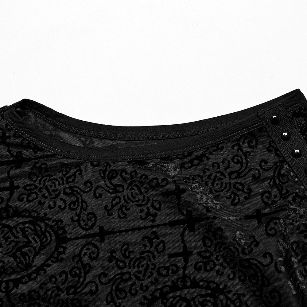 Close-up of Gothic black mesh top with flocking pattern and decorative webbing details.