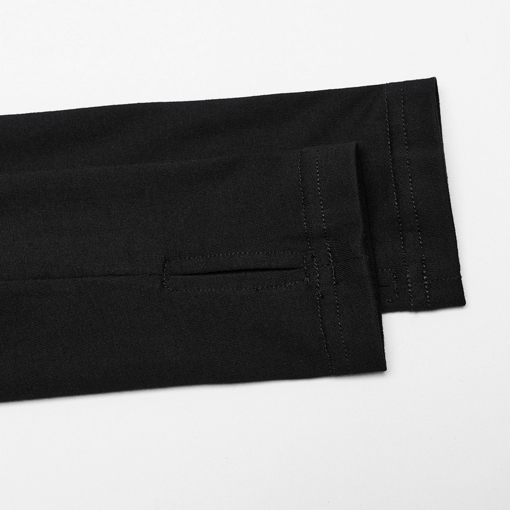 Close-up of the hem and seam details of a black hoodie with stylish stitching.