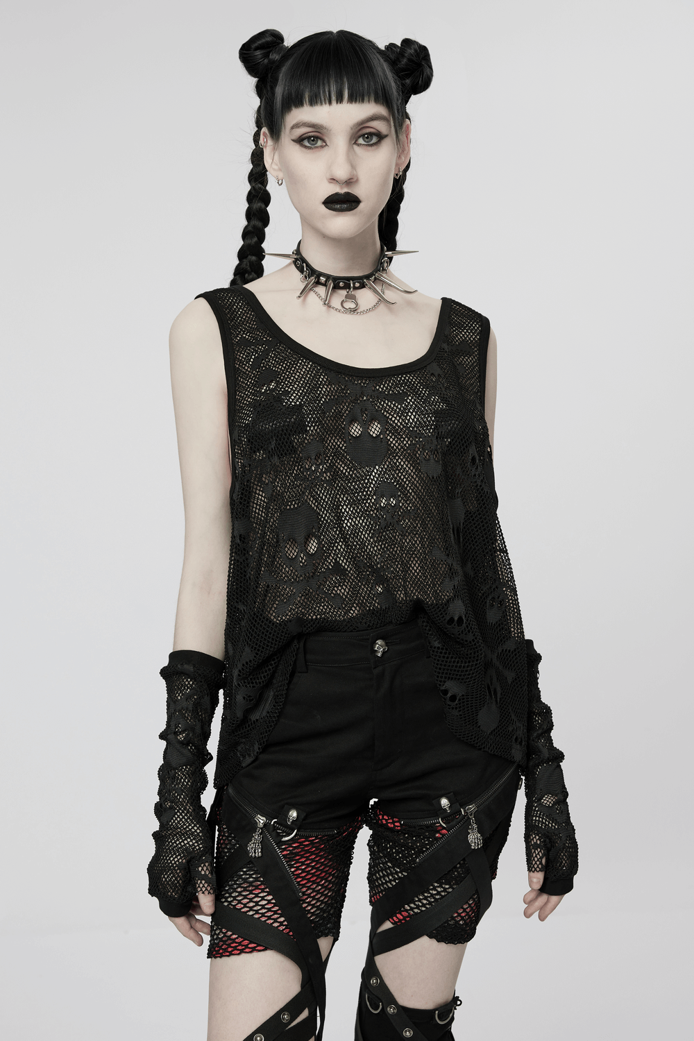 Edgy gothic mesh layered skull tank top with finger sleeves, paired with punk-style shorts and accessories.