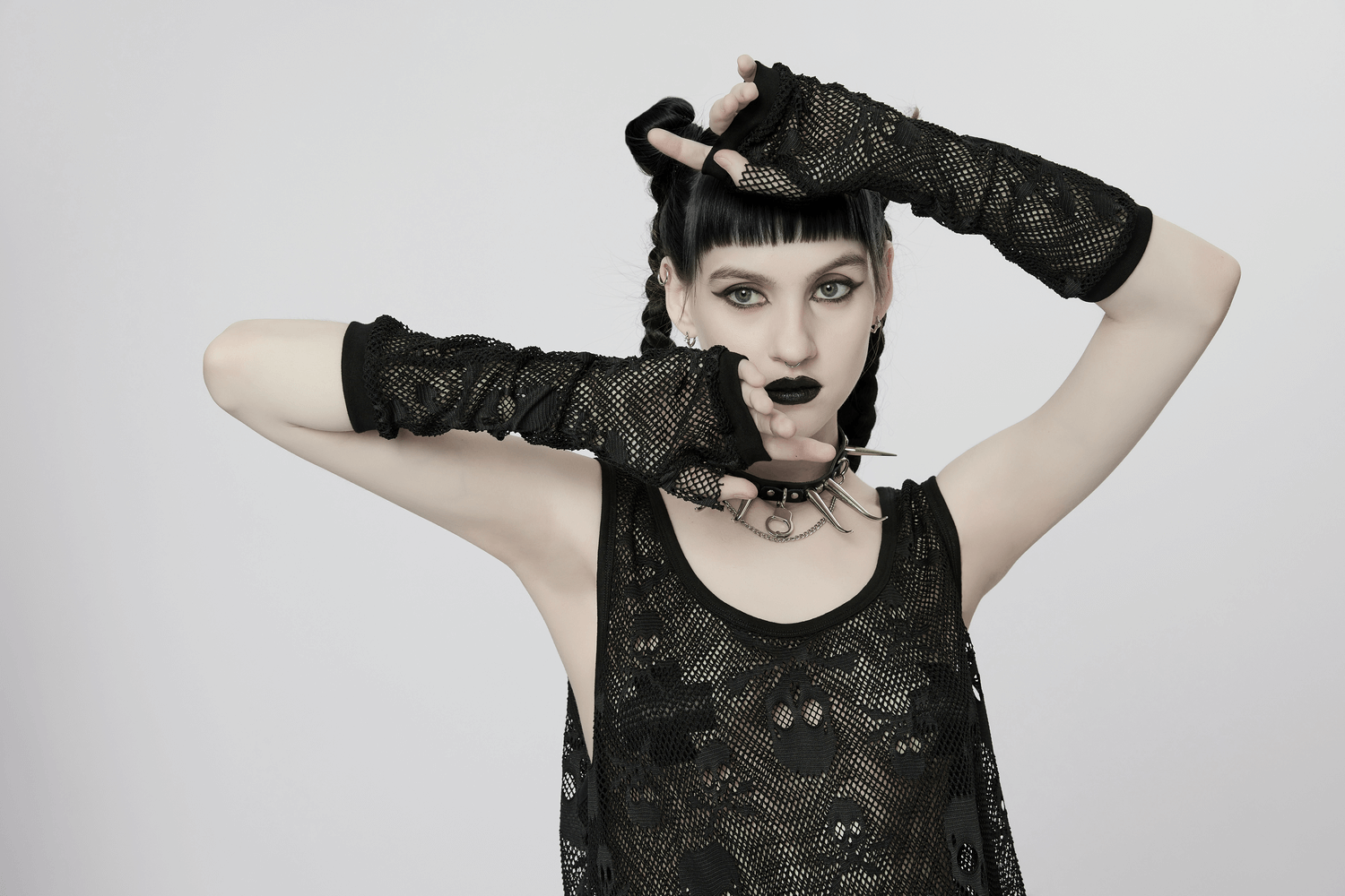 Edgy gothic mesh skull tank top with finger sleeves and punk accessories, perfect for rebellious style.