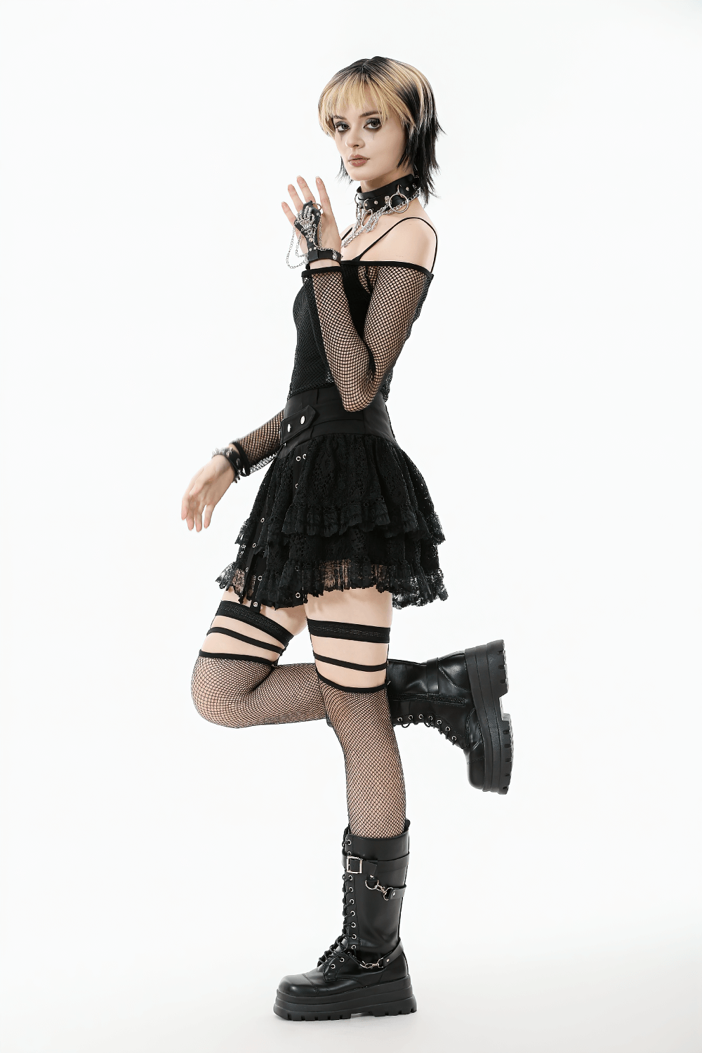 Gothic Mesh Off-Shoulder Long-Sleeved Top for Women worn with a layered black skirt and chunky boots, showcasing edgy gothic style.