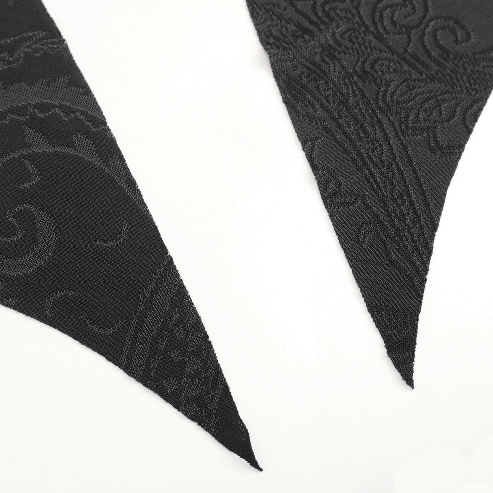 Close-up of textured black fabric showcasing intricate patterns for gothic-inspired fashion.