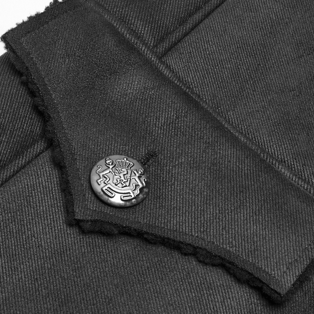 Close-up of gothic military coat collar featuring regal button detail in black fabric.